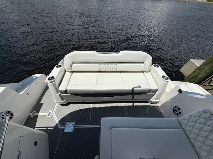  Yacht Photos Pics 2022 Regal 36 Grande Coupe boat with elegant white seating on deck.