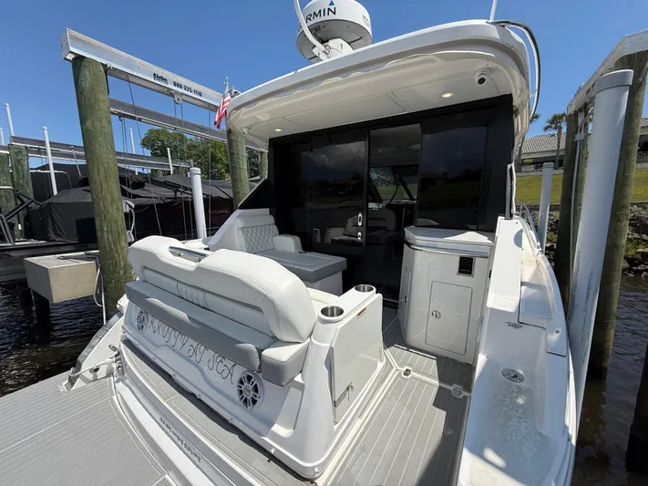  Yacht Photos Pics 2022 Regal 36 Grande Coupe yacht with spacious deck and seating area.