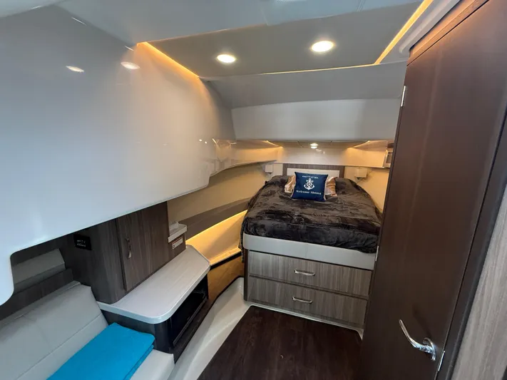  Yacht Photos Pics Interior cabin of 2022 Regal 36 Grande Coupe with modern design and cozy bedding.