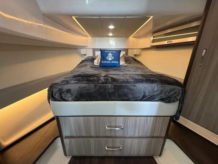  Yacht Photos Pics 2022 Regal 36 Grande Coupe interior cabin with cozy bed and modern design.