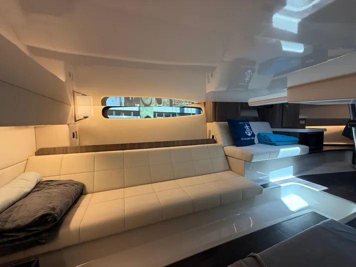  Yacht Photos Pics Interior of 2022 Regal 36 Grande Coupe, featuring modern seating and ambient lighting.
