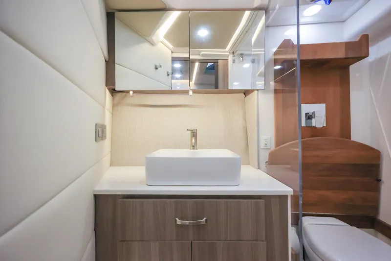  Yacht Photos Pics Modern bathroom interior of 2022 Regal 36 Grande Coupe yacht, featuring sleek design and fixtures.