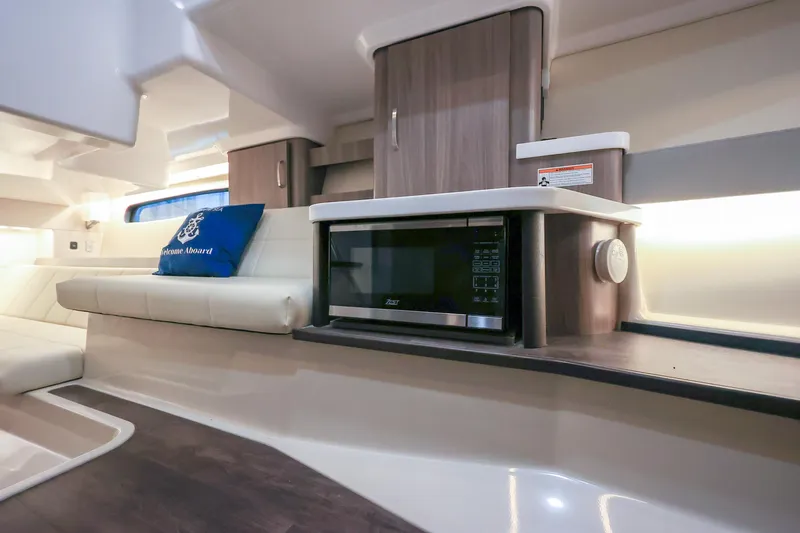  Yacht Photos Pics Interior of 2022 Regal 36 Grande Coupe with modern kitchen and seating area.