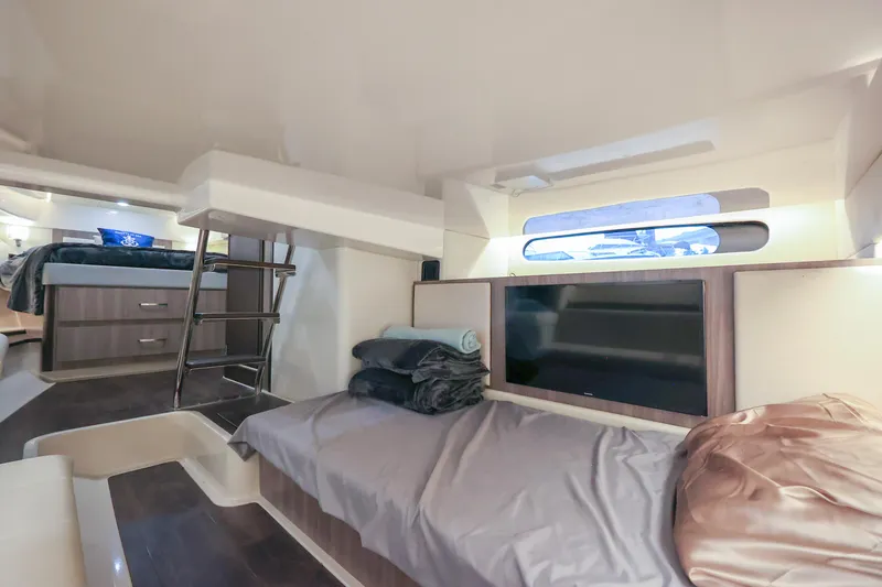  Yacht Photos Pics Interior of 2022 Regal 36 Grande Coupe yacht, featuring cozy sleeping area and modern design.