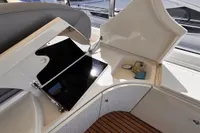 Interior of 2001 Pershing 65 yacht with open storage and sink area.
