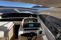 Interior view of 2001 Pershing 65 yacht cockpit with navigation controls and sea view.