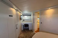 Luxurious interior of 2001 Pershing 65 yacht with modern furnishings and elegant design.