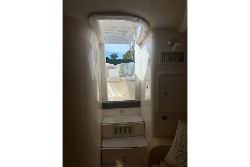 Summit Yacht Photos Pics Interior view of 2004 Intrepid 377 Walkaround boat, showing cabin steps and exterior.