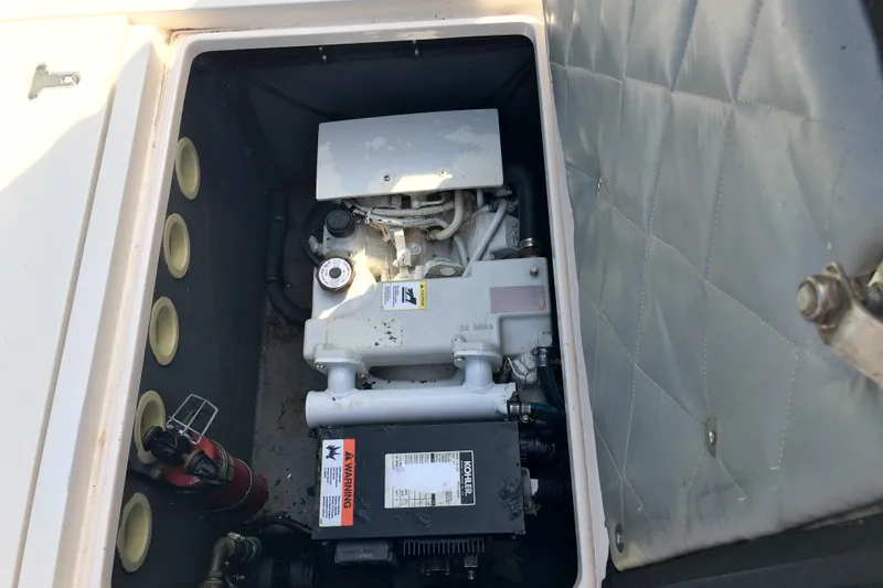 Summit Yacht Photos Pics Engine compartment of a 2004 Intrepid 377 Walkaround boat with visible components.