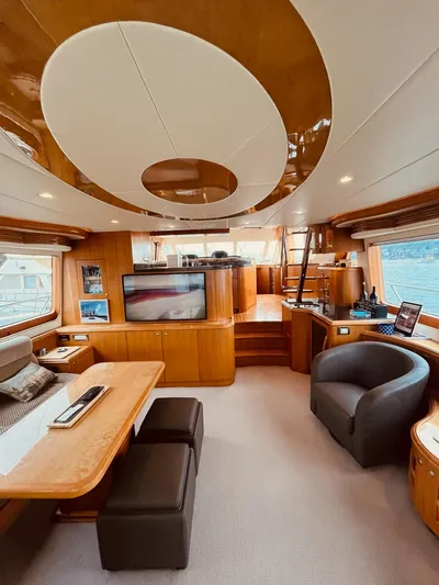 "conumdrum" Yacht Photos Pics Luxurious interior of 2007 Regency Yachts 670 Pilothouse with elegant wood finishes.