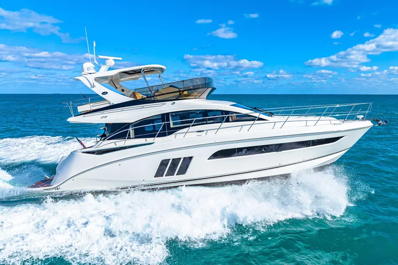 Kokomo Yacht Photos Pics 2016 Sea Ray 510 Fly yacht cruising on open ocean under clear blue sky.