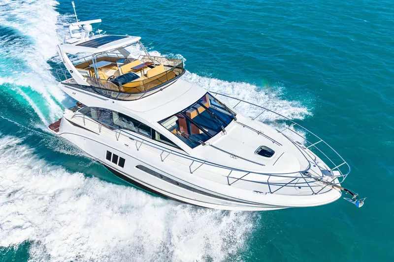 Kokomo Yacht Photos Pics 2016 Sea Ray 510 Fly yacht cruising on clear blue ocean waters.