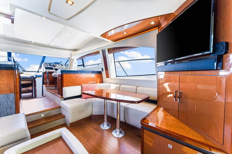 Kokomo Yacht Photos Pics Luxurious interior of 2016 Sea Ray 510 Fly yacht with modern furnishings and large windows.