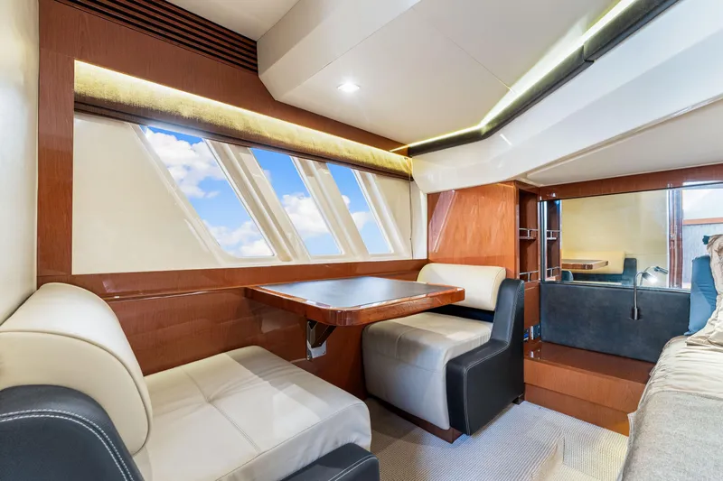 Kokomo Yacht Photos Pics Luxurious interior of 2016 Sea Ray 510 Fly yacht with elegant seating and large windows.