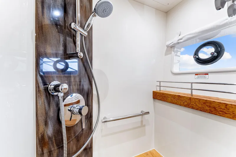 Kokomo Yacht Photos Pics Luxurious shower area in 2016 Sea Ray 510 Fly yacht with modern fixtures.