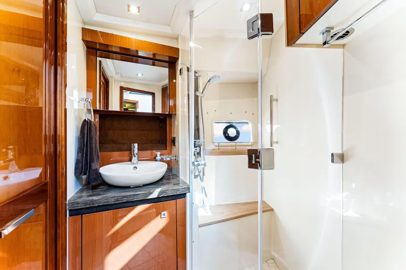 Kokomo Yacht Photos Pics Luxurious bathroom interior of 2016 Sea Ray 510 Fly yacht with modern fixtures.
