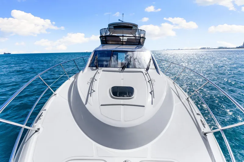 Kokomo Yacht Photos Pics 2016 Sea Ray 510 Fly yacht cruising on open water under a clear blue sky.