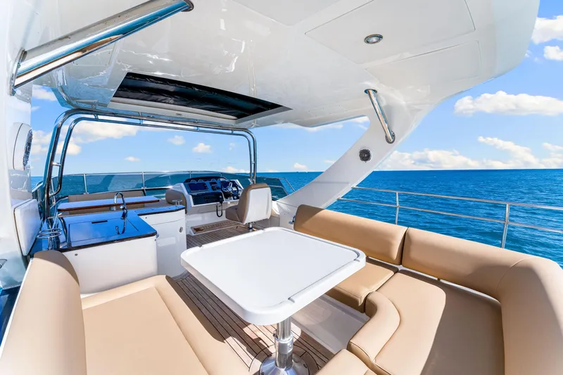 Kokomo Yacht Photos Pics Luxurious 2016 Sea Ray 510 Fly yacht interior with ocean view, featuring elegant seating and helm.
