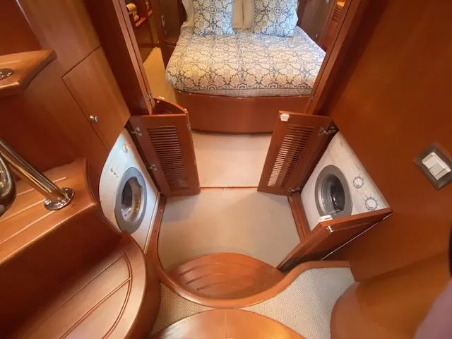 "conumdrum" Yacht Photos Pics 2007 Regency Yachts 670 Pilothouse interior with washer and dryer units.