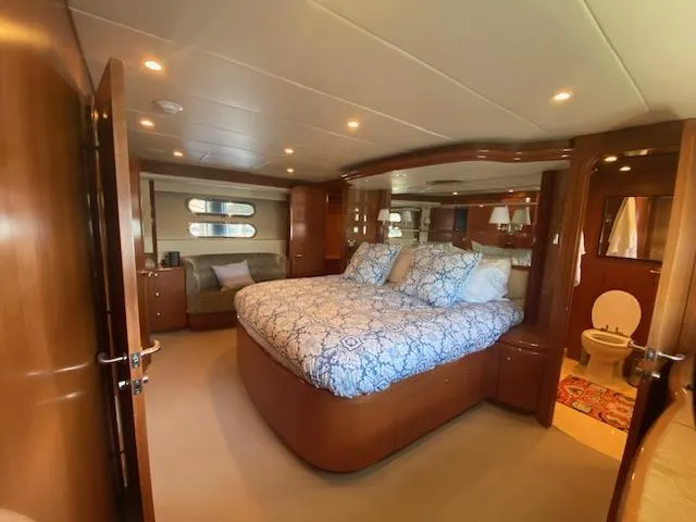 "conumdrum" Yacht Photos Pics Luxurious master bedroom in 2007 Regency Yachts 670 Pilothouse with ensuite bathroom.