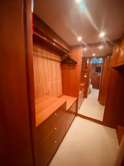 "conumdrum" Yacht Photos Pics 2007 Regency Yachts 670 Pilothouse walk-in closet with wooden cabinetry and ample storage.