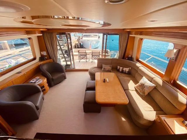 "conumdrum" Yacht Photos Pics Luxurious interior of 2007 Regency Yachts 670 Pilothouse with spacious seating and ocean view.