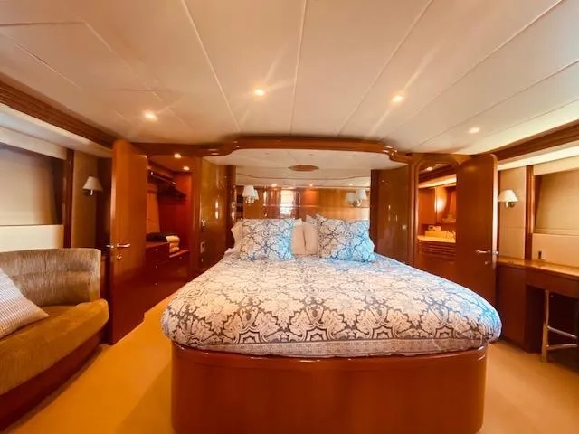 "conumdrum" Yacht Photos Pics Luxurious master bedroom in 2007 Regency Yachts 670 Pilothouse with elegant wood finishes.
