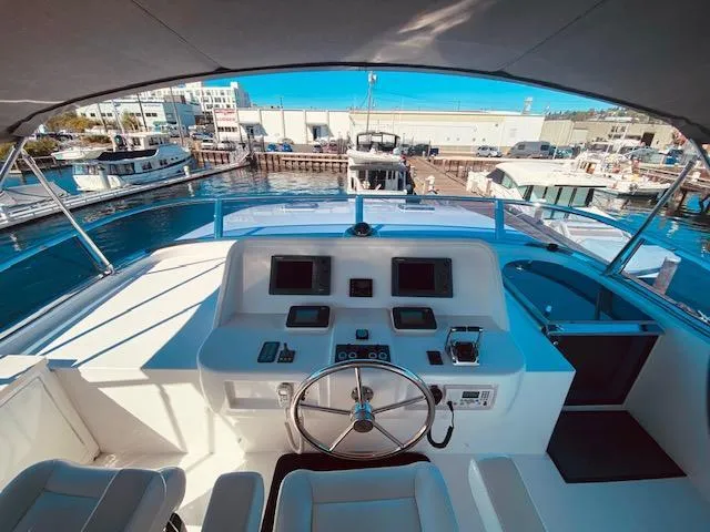 "conumdrum" Yacht Photos Pics 2007 Regency Yachts 670 Pilothouse helm station with marina view