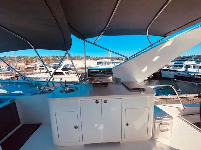 "conumdrum" Yacht Photos Pics Outdoor kitchen on 2007 Regency Yachts 670 Pilothouse, docked at marina.