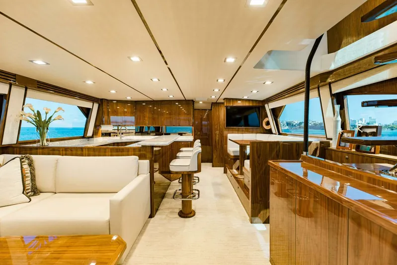Sari Victoria Yacht Photos Pics Luxurious interior of 2020 Viking 72 yacht with elegant wood finishes and modern furnishings.