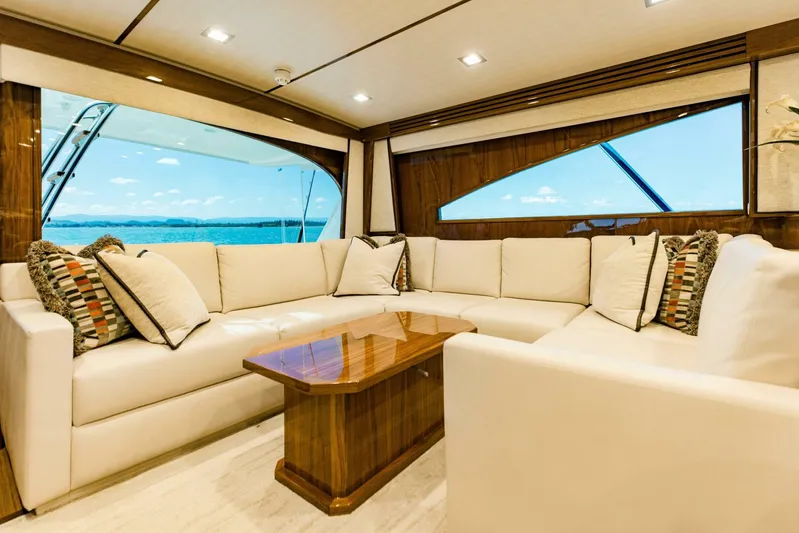 Sari Victoria Yacht Photos Pics Luxurious interior of 2020 Viking 72 yacht with elegant seating and ocean view.