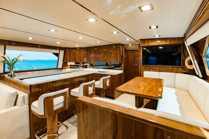Sari Victoria Yacht Photos Pics Luxurious interior of 2020 Viking 72 yacht with modern kitchen and dining area.