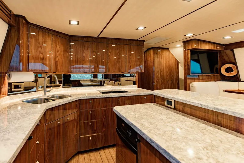 Sari Victoria Yacht Photos Pics Luxurious 2020 Viking 72 yacht interior with modern kitchen and elegant wood finishes.
