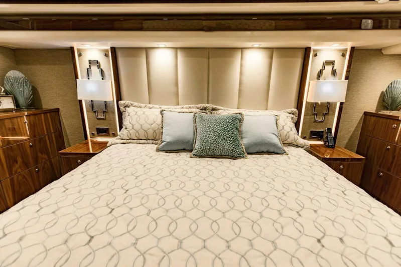Sari Victoria Yacht Photos Pics Luxurious bedroom interior on 2020 Viking 72 yacht with elegant bedding and modern decor.