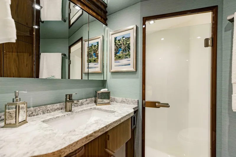 Sari Victoria Yacht Photos Pics Luxurious bathroom in 2020 Viking 72 yacht with marble countertop and glass shower door.