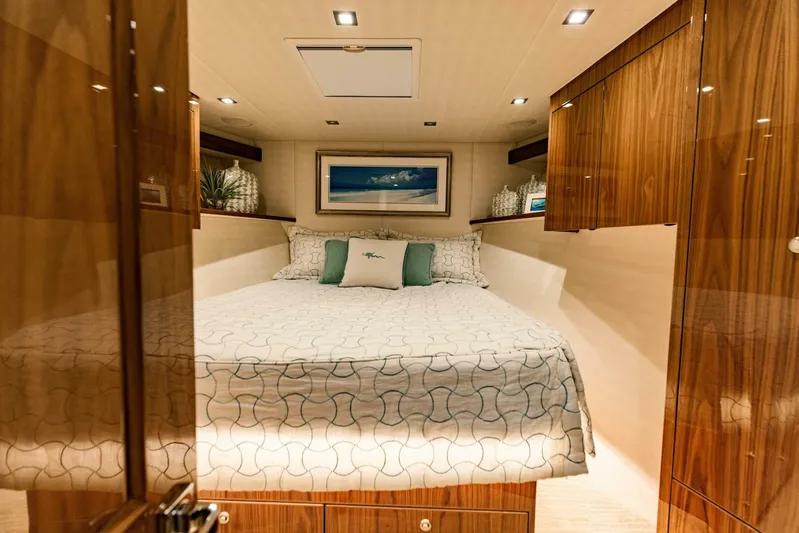 Sari Victoria Yacht Photos Pics Luxurious bedroom interior of 2020 Viking 72 yacht with elegant wood finishes.