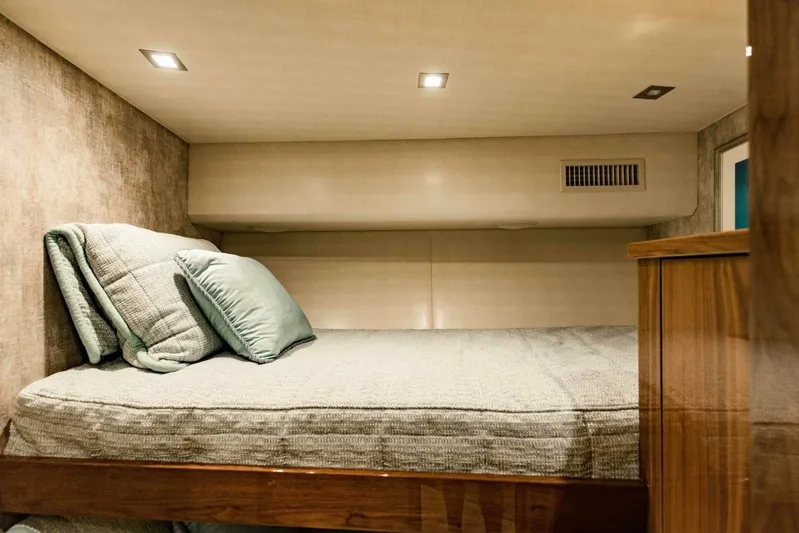 Sari Victoria Yacht Photos Pics Cozy cabin bed in 2020 Viking 72 yacht with soft lighting and plush bedding.