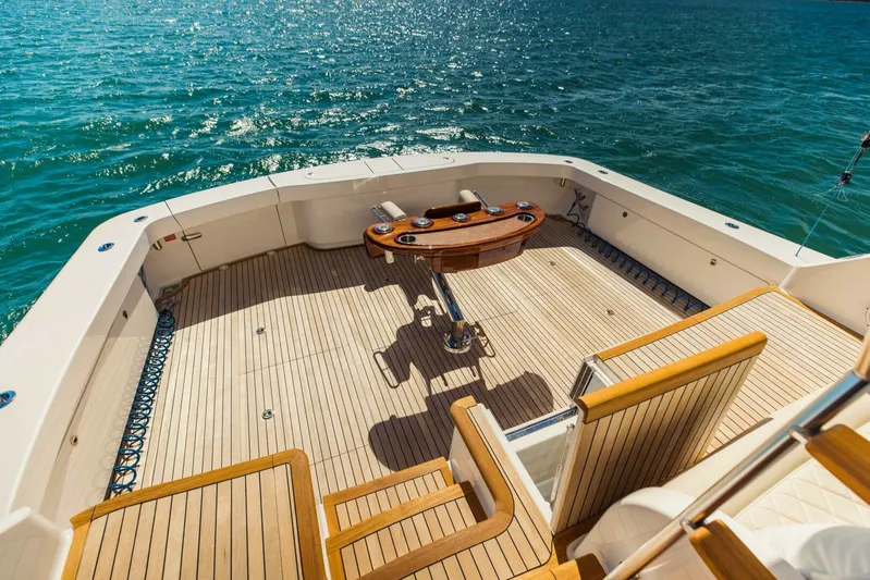 Sari Victoria Yacht Photos Pics Luxurious 2020 Viking 72 yacht deck with wooden flooring and ocean view.