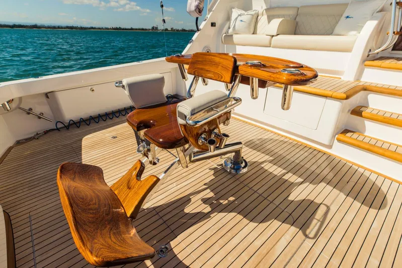 Sari Victoria Yacht Photos Pics Luxurious 2020 Viking 72 yacht deck with polished wood seating and ocean view.