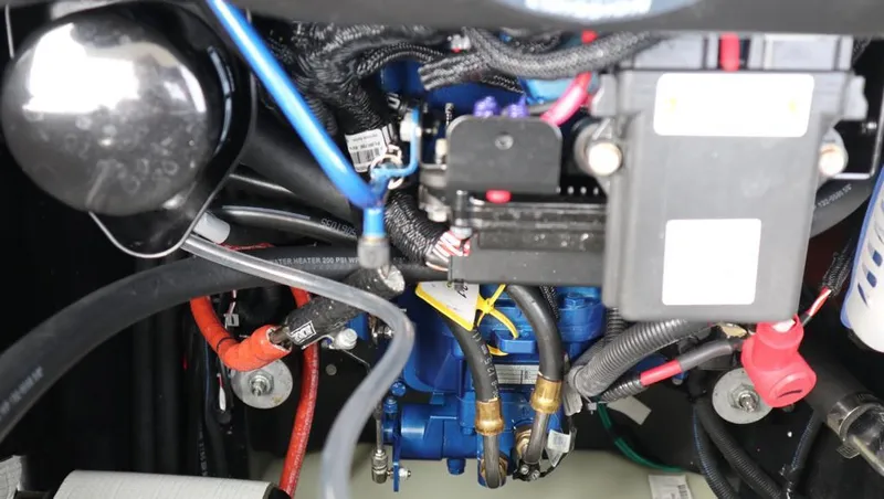 Three Wishes Yacht Photos Pics Engine compartment of a 2000 Bertram 36 SF boat, showcasing wiring and components.