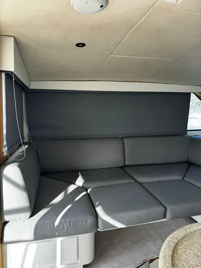 Three Wishes Yacht Photos Pics Interior of 2000 Bertram 36 SF yacht with gray seating and modern design.