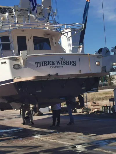 Three Wishes Yacht Photos Pics Bertram 36 SF 2000 yacht "Three Wishes" on dry dock for maintenance.