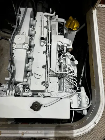 Three Wishes Yacht Photos Pics Engine compartment of a 2000 Bertram 36 SF boat, showcasing mechanical components.