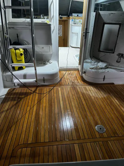 Three Wishes Yacht Photos Pics Bertram 36 SF 2000 model with polished wooden deck and interior view.