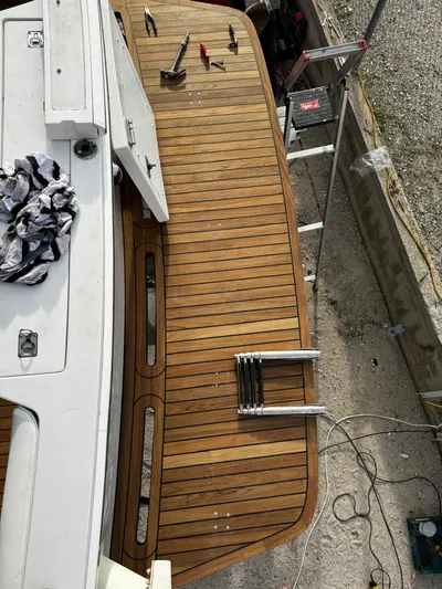 Three Wishes Yacht Photos Pics Bertram 36 SF 2000 model with wooden deck, tools, and ladder visible.