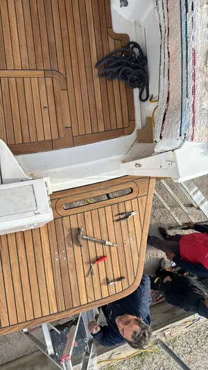 Three Wishes Yacht Photos Pics Bertram 36 SF 2000 model boat deck with tools and coiled rope.