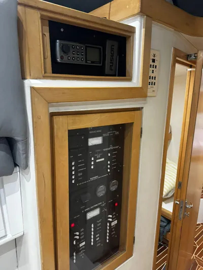 Three Wishes Yacht Photos Pics Control panel inside a 2000 Bertram 36 SF boat, featuring navigation and communication equipment.