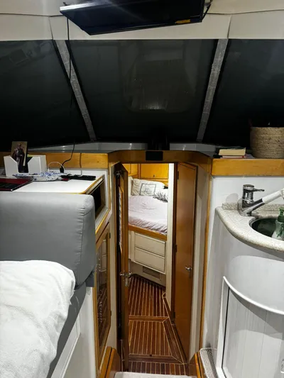 Three Wishes Yacht Photos Pics Interior of a 2000 Bertram 36 SF yacht, featuring a cozy cabin and modern amenities.