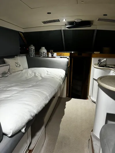 Three Wishes Yacht Photos Pics Interior of a 2000 Bertram 36 SF yacht with cozy bed and modern amenities.