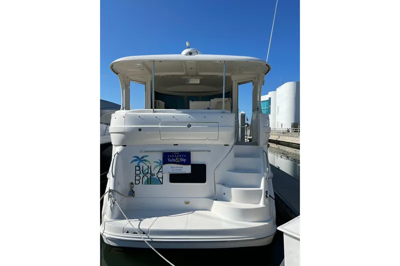 Bula Bula Yacht Photos Pics 2006 Sea Ray 40 Motor Yacht docked, rear view with clear blue sky.
